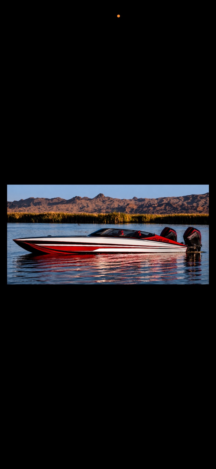 Red, white and black Axiom performance catamaran with twin outboards on the water in front of desert mountains